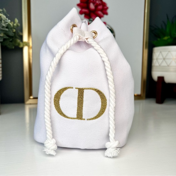 Dior Handbags - Dior White Canvas Drawstring Cosmetic Pouch with Gold Logo